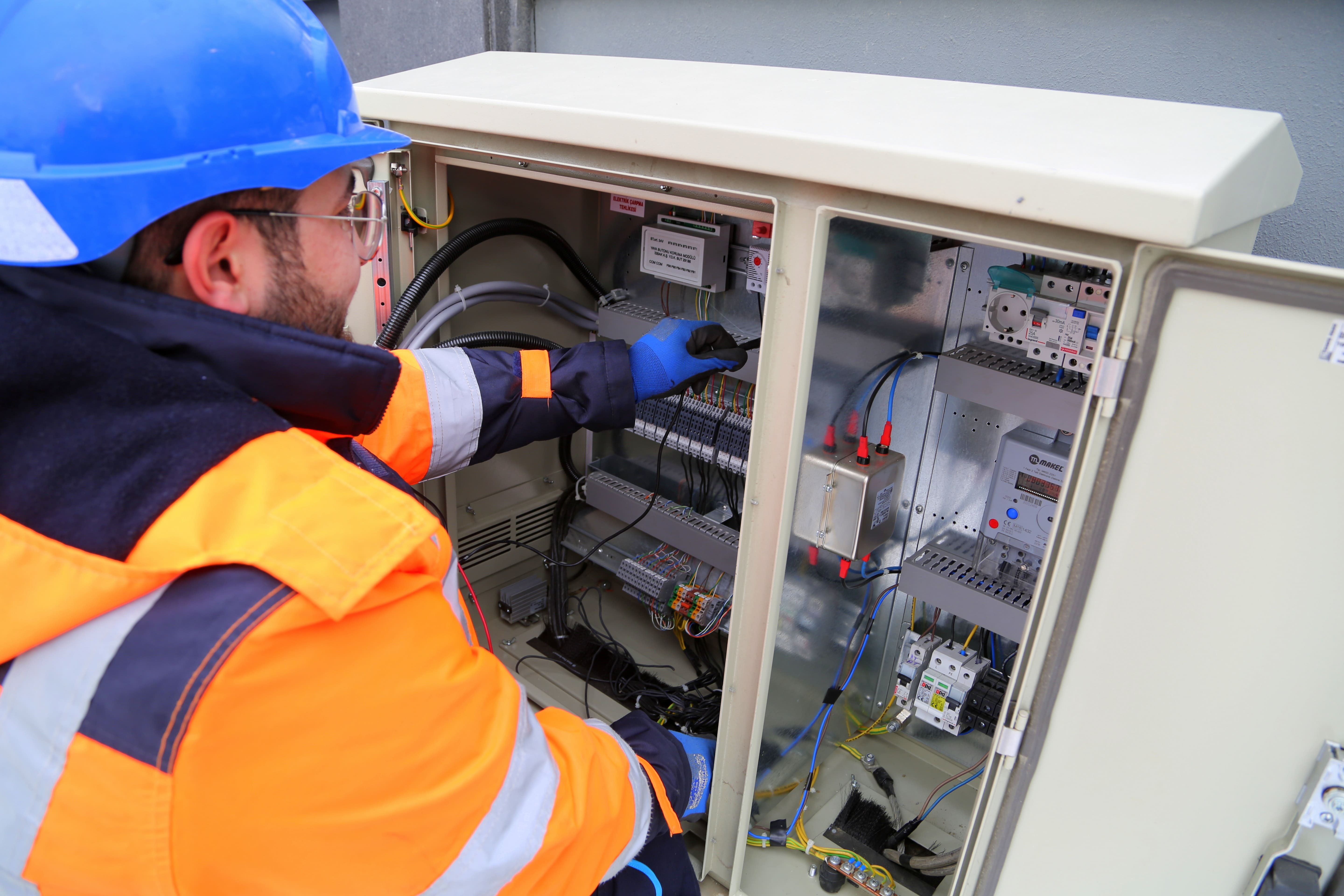 electrician working on a panel